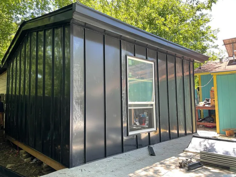 Black standing seam metal wall panels for Metal Roof Installation in Crookston