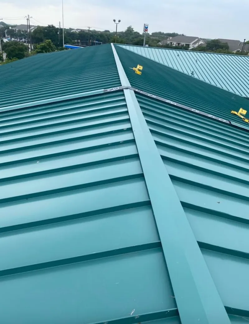 Green commercial metal roof ridge and valley for Metal Roof Repair in Crookston